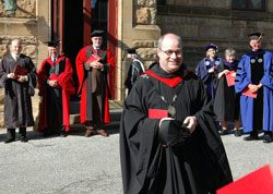 Benedictine Father Denis Robinson smiles at well-wishers at the conclusion of the inaugural convocation on Oct. 4. (Submitted photo) 