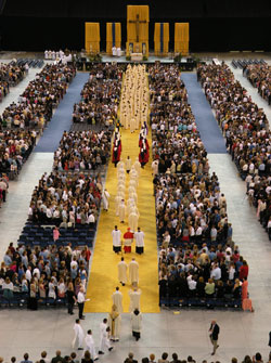 A portion of the entrance procession, made up of priests, bishops and members of the Knights of Columbus, fills the length of Lucas Oil Stadium at the start of the 175th anniversary Mass on May 3. (Photo by Brandon A. Evans) 