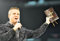 Life Teen executive vice president Mark Hart of Phoenix urges National Catholic Youth Conference participants to read the Bible during his keynote address on Nov. 18 at Lucas Oil Stadium in Indianapolis. (Photo by Mary Ann Garber)