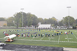 Participants during the rosary rally stand on the football field while leading the praying of a living rosary on Sept. 29. (Submitted photo)