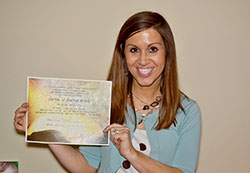 Tristan McGill poses with a certificate welcoming her into full communion with the Catholic Church on April 19 after receiving the sacraments of Eucharist and confirmation at the Easter Vigil Mass at St. Barnabas Parish in Indianapolis. (Submitted photo)