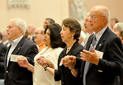 Steven and Rita Beck, left, and Ann and Art Berkemeier hold hands for the Our Father during a Mass for Miter Society members on May 8 at SS. Peter and Paul Cathedral in Indianapolis. The Becks are members of SS. Francis and Clare Parish in Greenwood, and the Berkemeiers are members of St. Mark the Evangelist Parish in Indianapolis. (Photos by Natalie Hoefer)