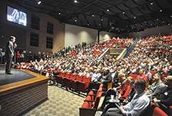 Dr. Ray Guarendi speaks on Feb. 24 before more than 1,200 men at the third annual E6 Catholic Men’s Conference at East Central High School in St. Leon. The conference was organized by All Saints Parish in Dearborn County in the Batesville Deanery. (Photo by Sean Gallagher)