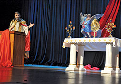 Father Jonathan Meyer, pastor of All Saints Parish in Dearborn County, gives a reflection during a time of eucharistic adoration during the fourth annual E6 Catholic Men’s Conference on Feb. 23 at East Central High School in St. Leon. (Photo by Sean Gallagher)