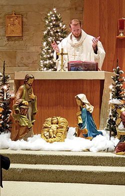 Father Daniel Bedel, pastor of St. Margaret Mary Parish in Terre Haute, celebtrates Mass in the church on Jan. 3. (Submitted photo)