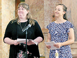 Providence Sister Arrianne Whitaker, left, and Providence Sister Tracey Horan smile during an Aug. 20 Mass at the Church of the Immaculate Conception at the motherhouse of the Sisters of Providence of Saint Mary-of-the-Woods in St. Mary-of-the-Woods during which they professed perpetual vows as a member of the congregation. Sister Arrianne, a graduate of the Marian University College of Osteopathic Medicine in Indianapolis, is a doctor in residence at St. Vincent Hospital in Indianapolis. Sister Tracey, who grew up in St. Jude Parish and is a graduate of Roncalli High School, both in Indianapolis, serves as the associate director of education and advocacy at the Kino Border Initiative in Nogales, Ariz. (Submitted photo)